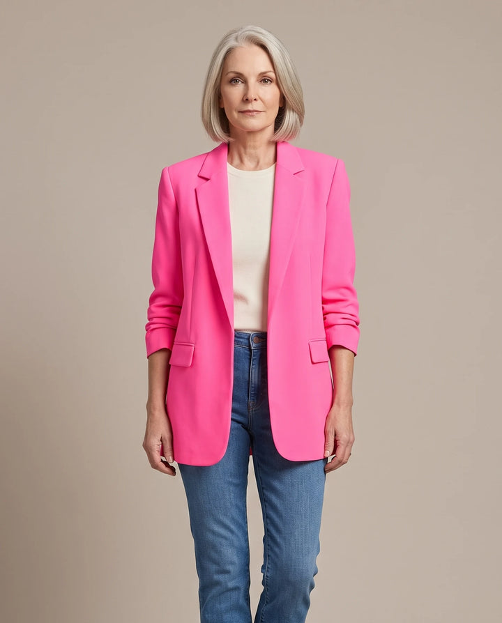 Delphine oversized open-front blazer in bright pink, shown open over an ivory top with blue jeans