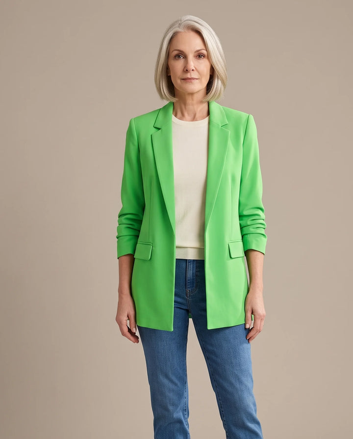 Delphine oversized open-front blazer in grass green, shown open over an ivory top with blue jeans