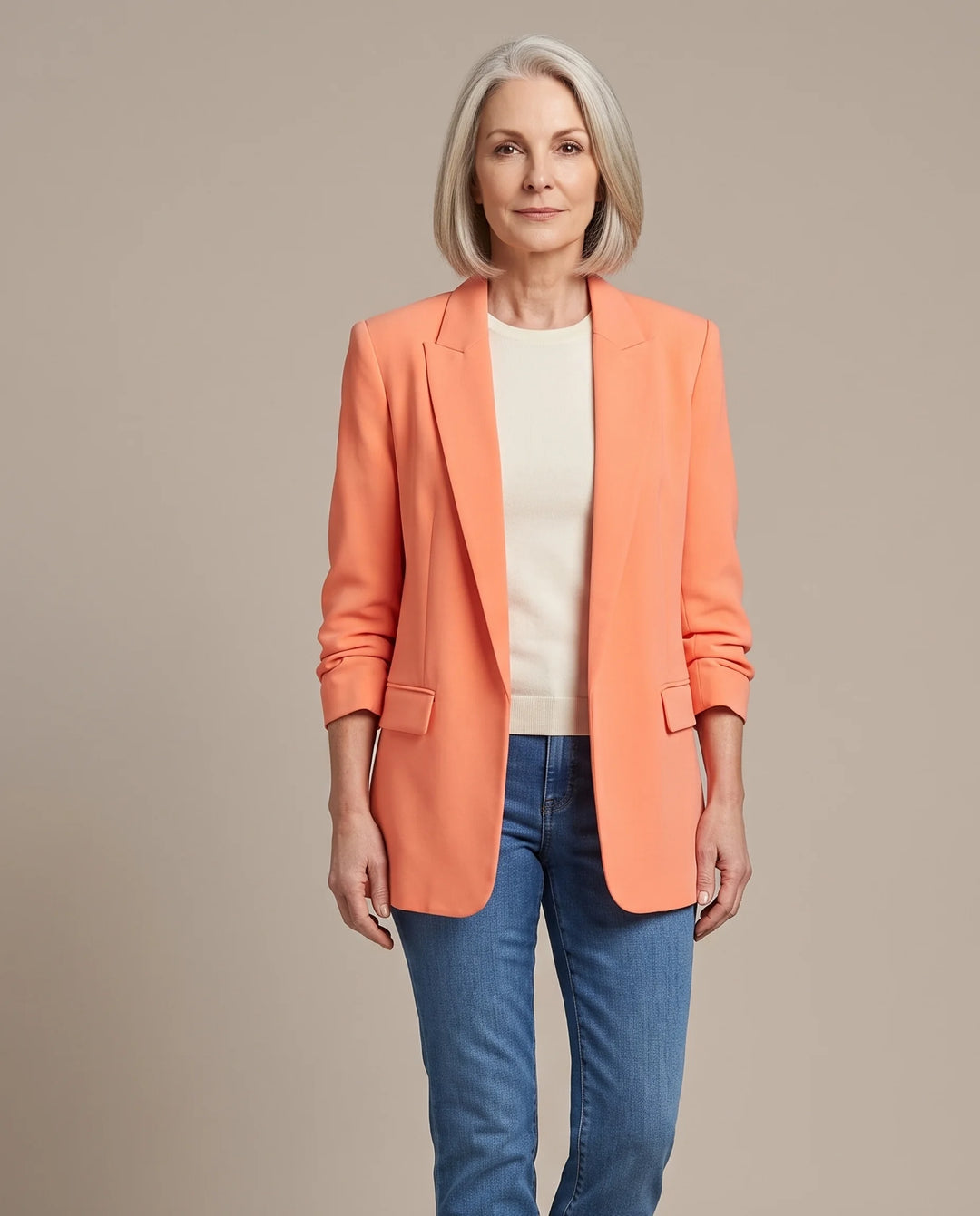 Delphine oversized open-front blazer in orange, shown open over an ivory top with blue jeans