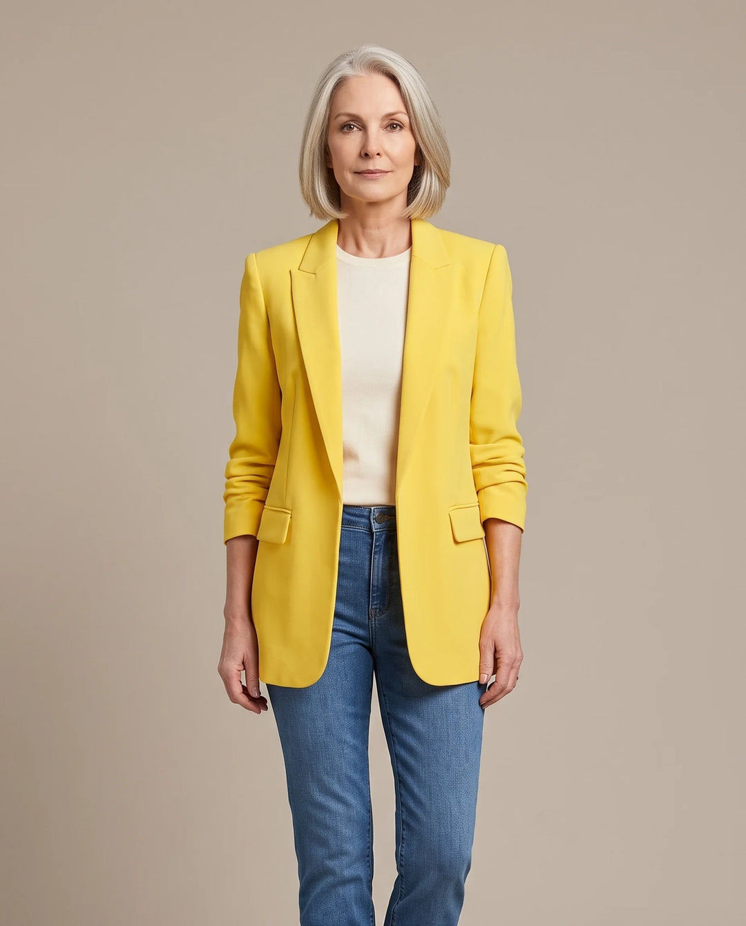 Delphine oversized open-front blazer in yellow, shown open over an ivory top with blue jeans